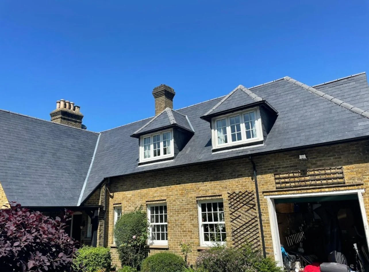 Newly fitted slate roof on a London home by StormRidge Roofing & Building