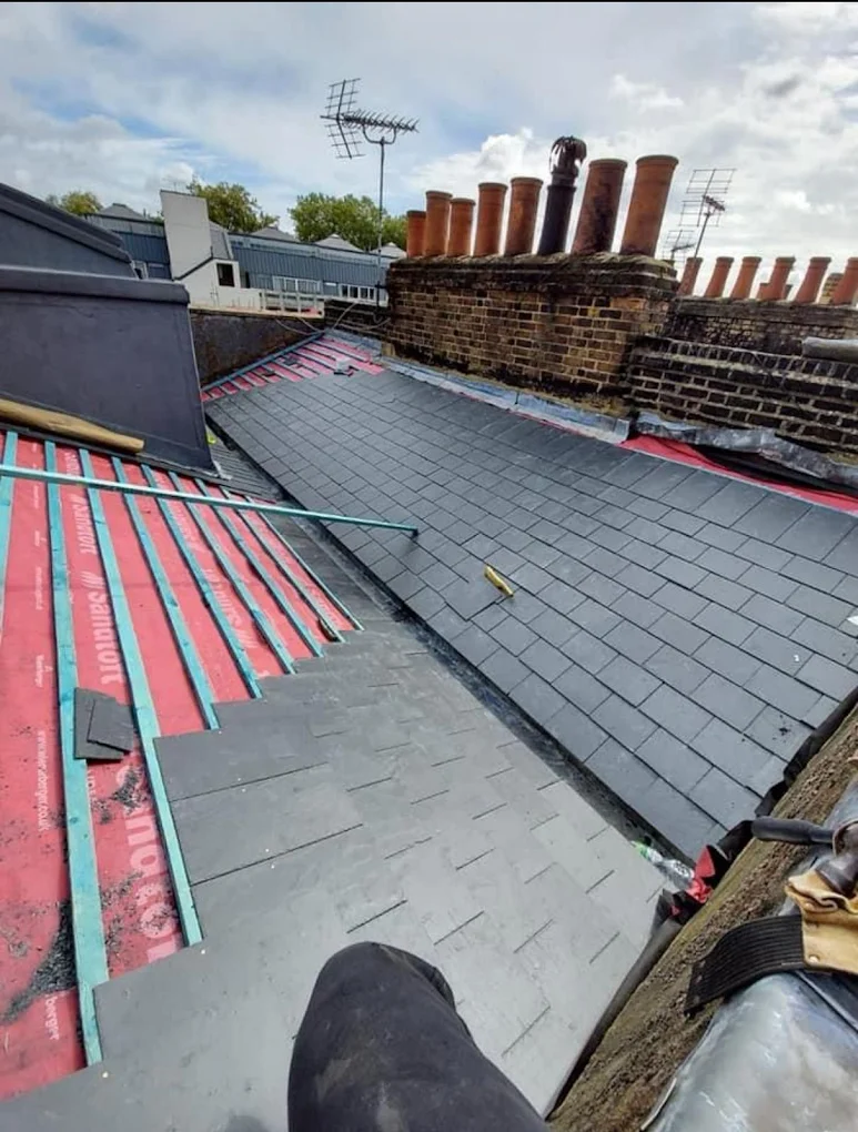 Slate re-roof in progress on a period terrace