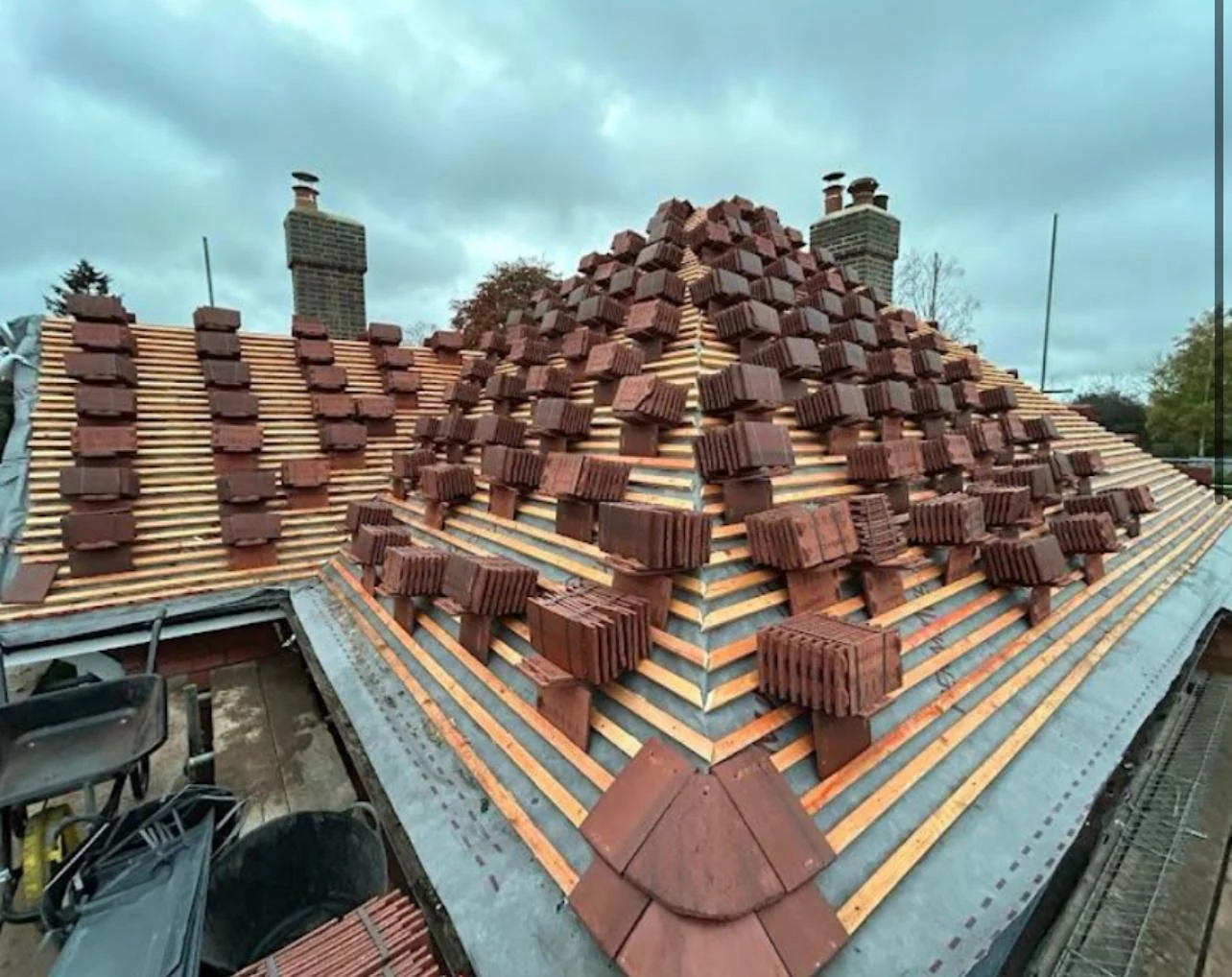 Hipped roof being re-tiled — batten and felt stage